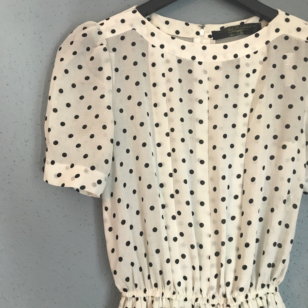 White and black polka dotted dress.